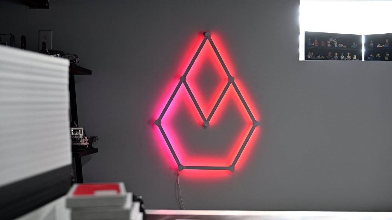 Nanoleaf Lines sitting behind our desk flickering like a candle