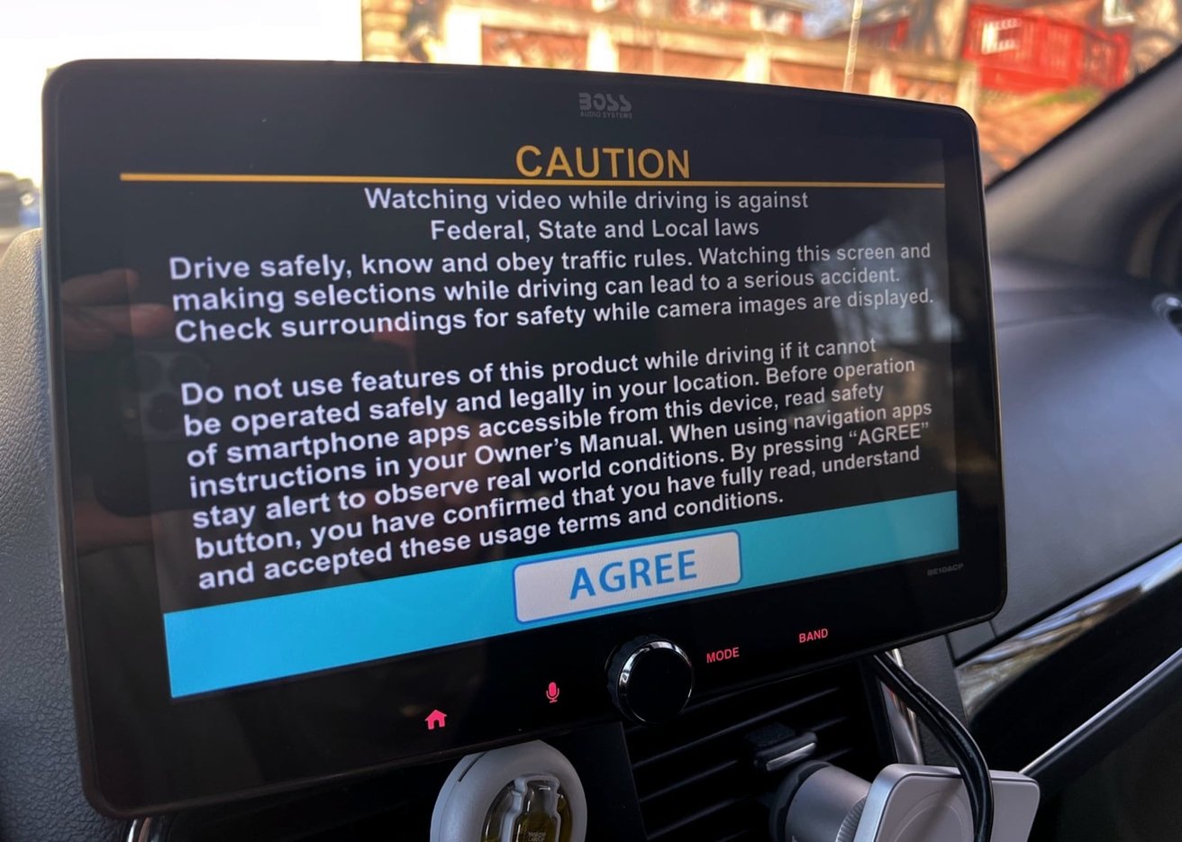 The display shows a large disclaimer, basically telling you not to watch video while driving. 