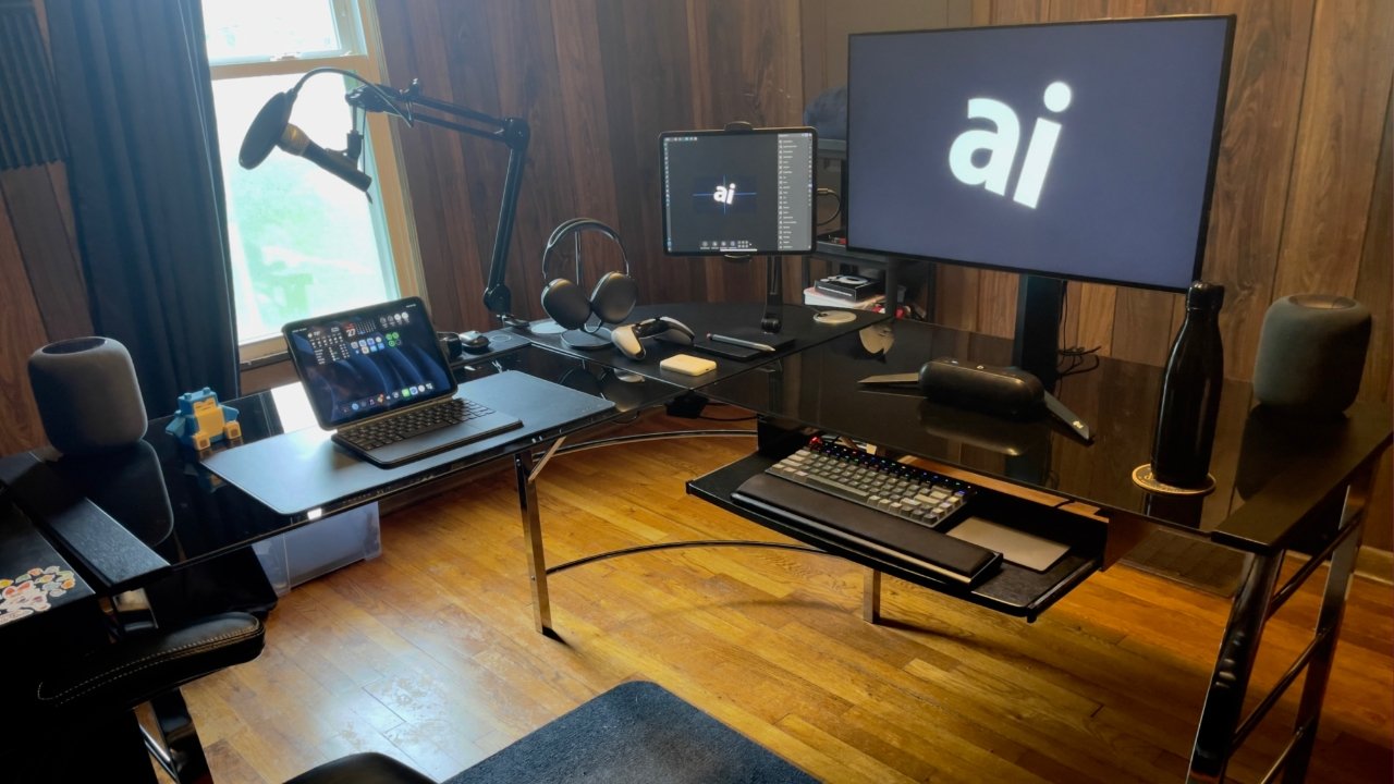 An iPad Pro desk setup using a Thunderbolt hub to connect all the pieces