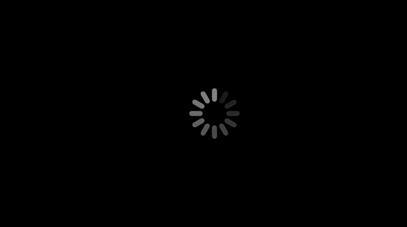 The black screen also contains a white spinning wheel. If you see this for too long, then there's a problem. 