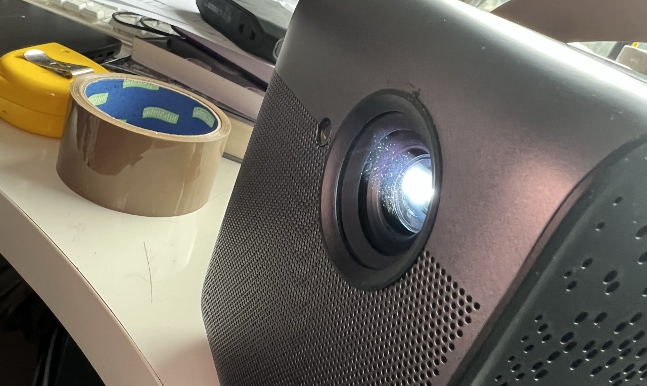 To the side of the projector lens is a sensor used for autofocusing