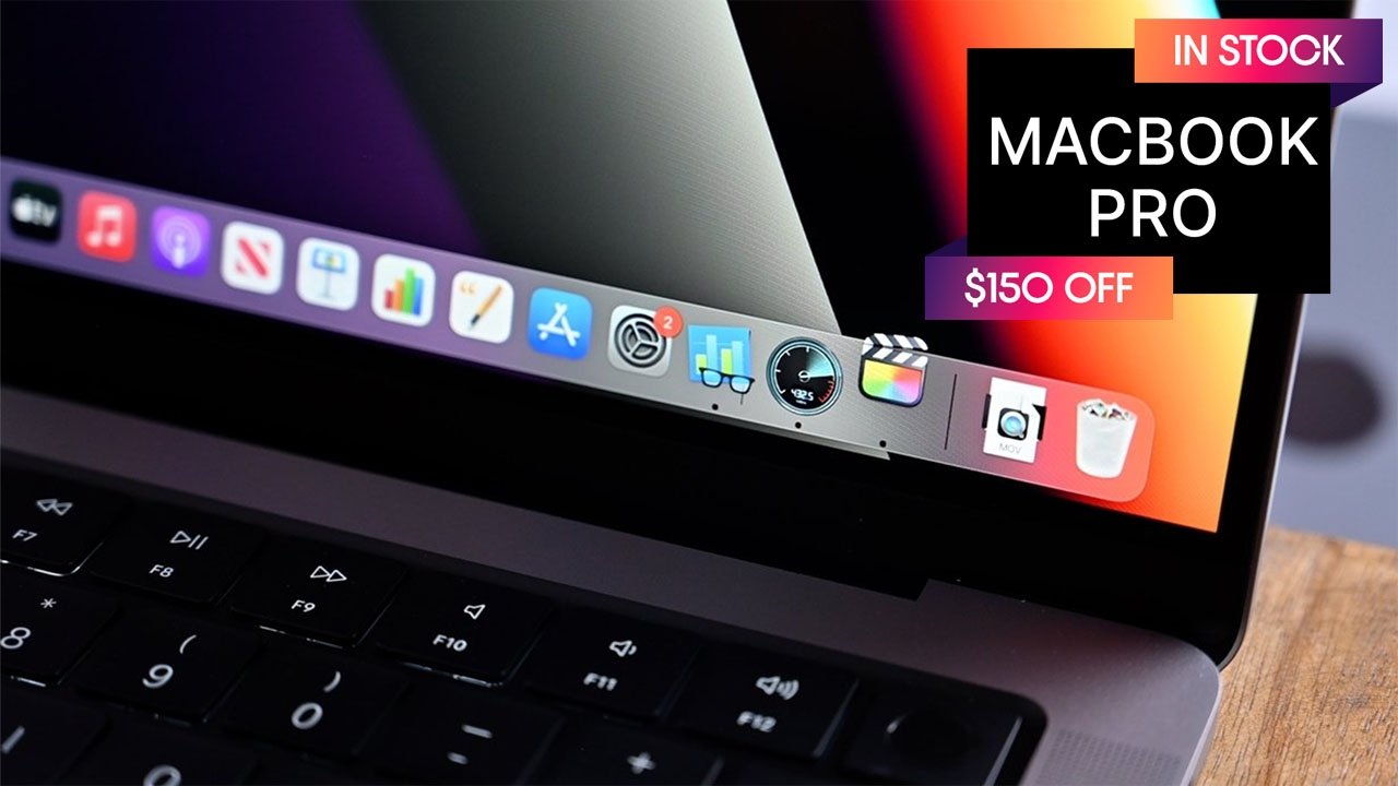 Closeup of Apple MacBook Pro 14-inch with in stock and $150 off neon banner