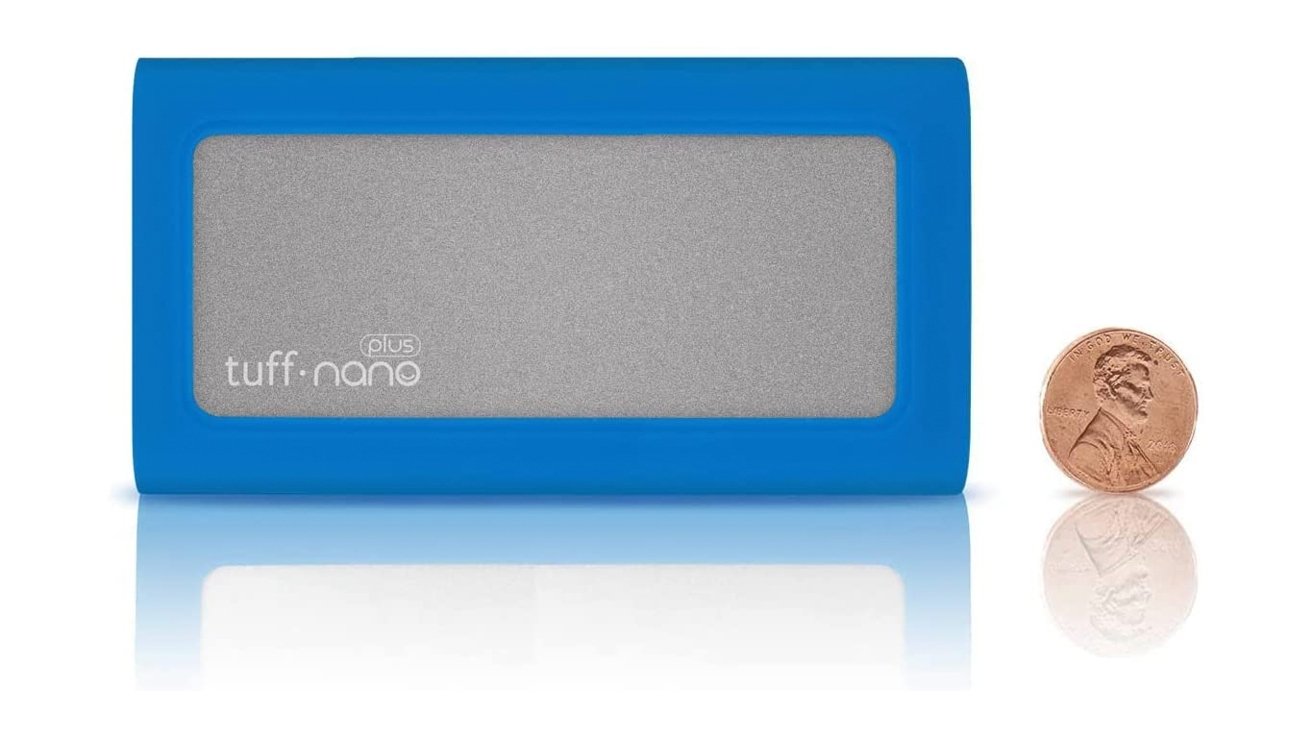 CalDigit Tough Nano Plus Portable SSD in blue color next to a penny