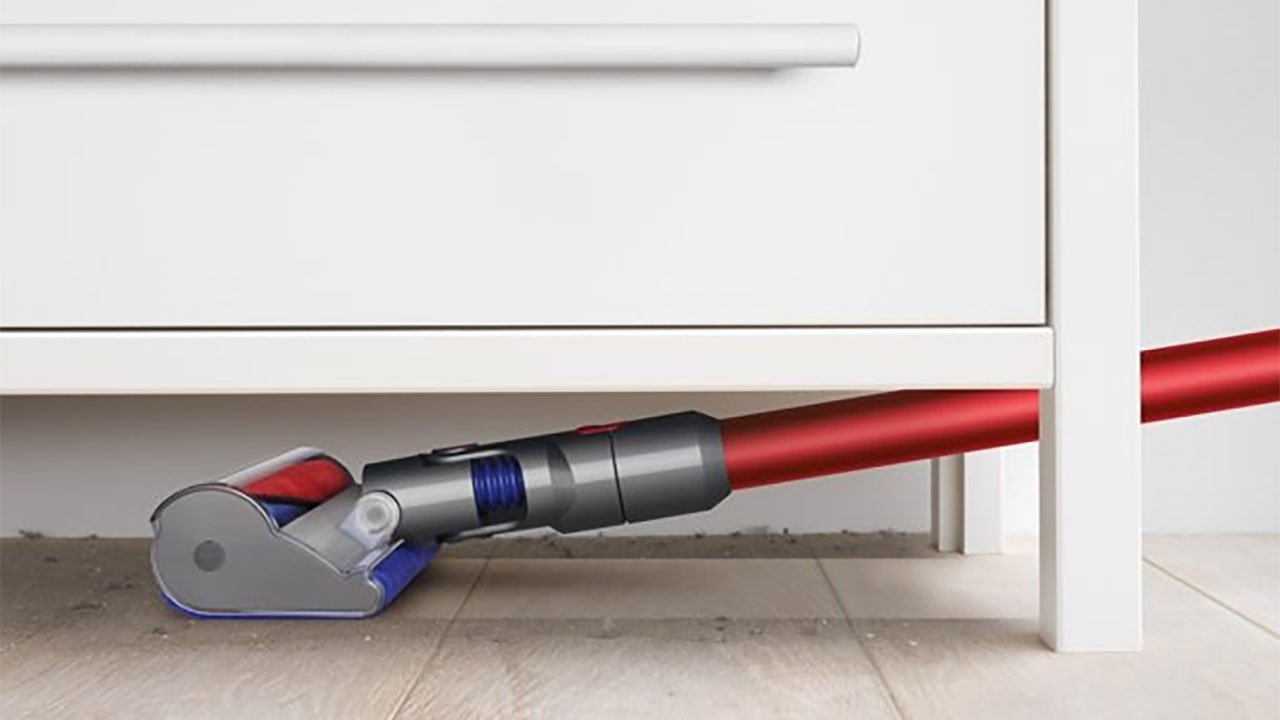 Dyson V8 Cordless Vacuum cleaning under cabinet