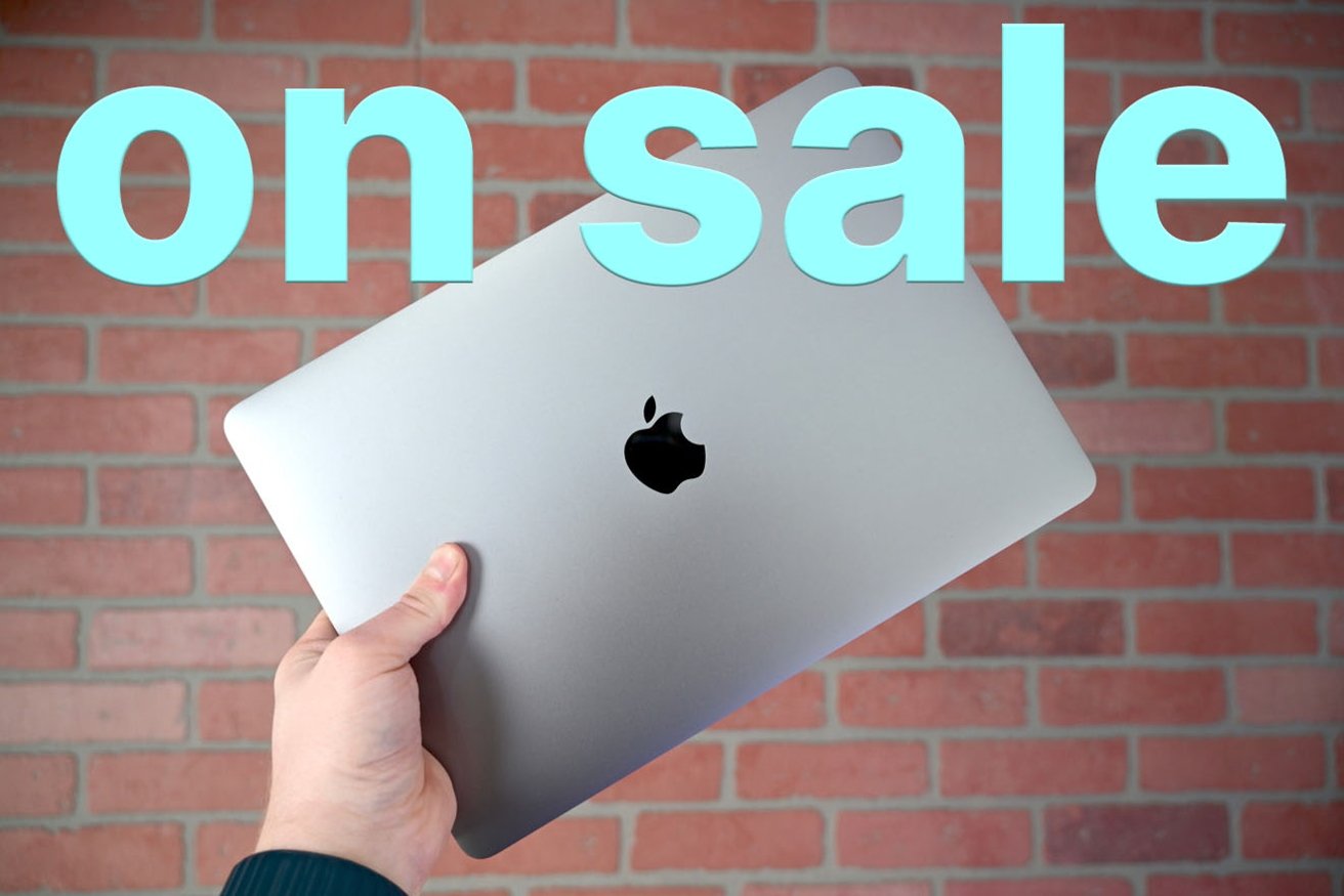 Apple MacBook Air in Space Gray held up with blue on sale text