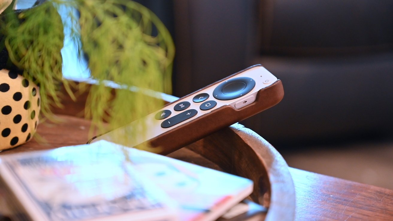 Our Siri Remote on the living room table with the Nomad leather cover