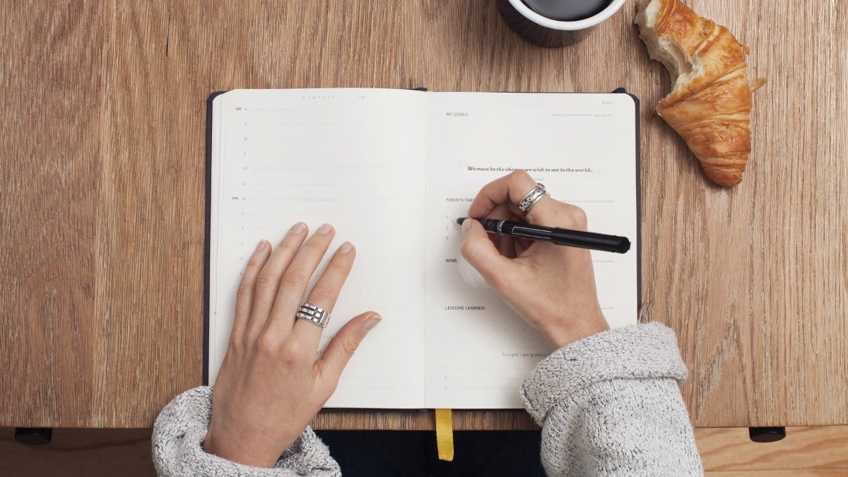 Woman writing in journal