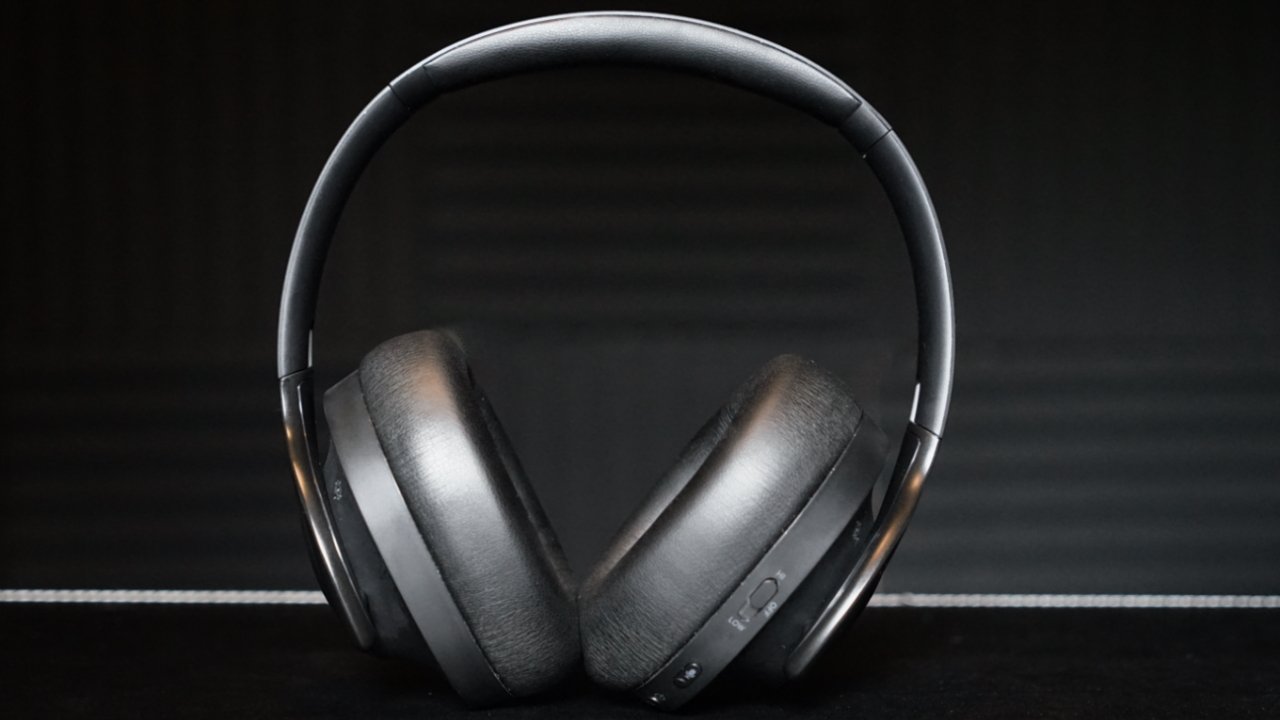 These headphones are black, but the plastic can be highly reflective in direct light
