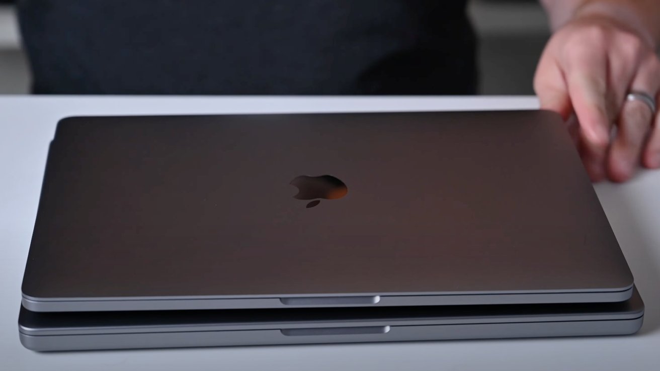 13-inch MacBook Pro on top of the 14-inch MacBook Pro
