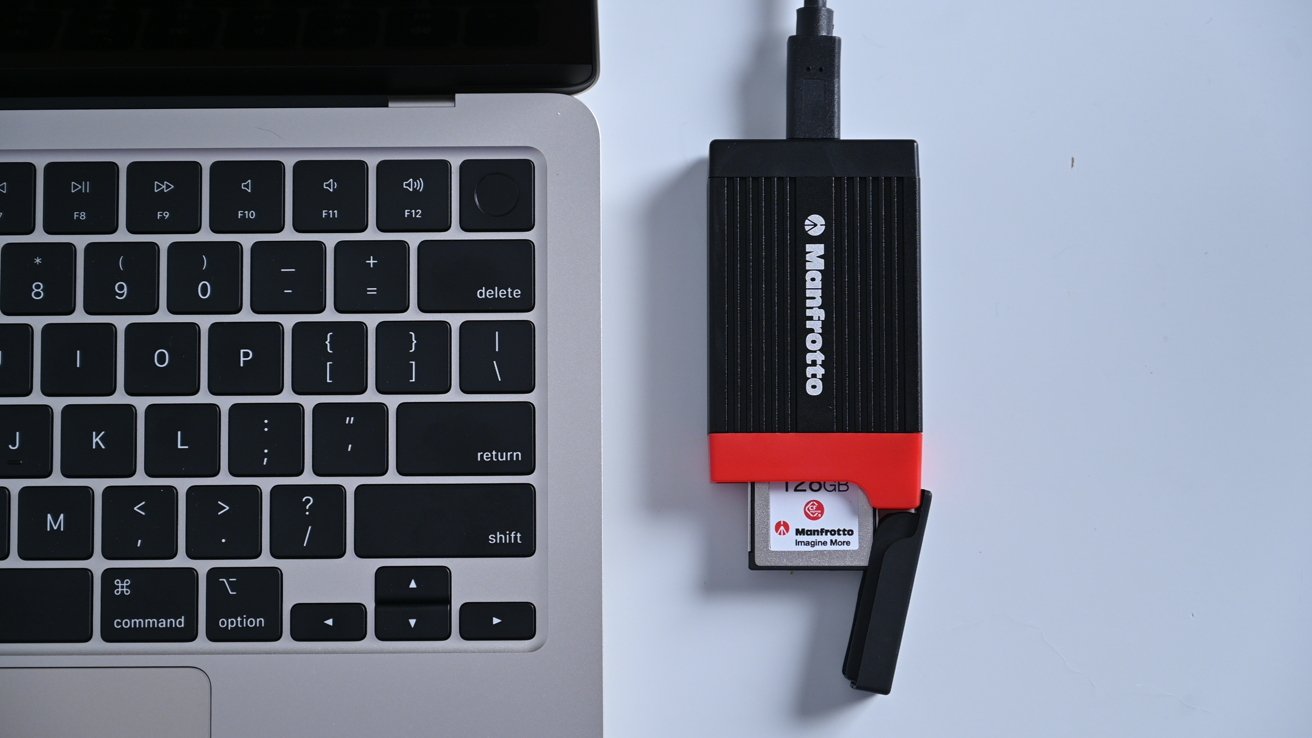 Manfrotto card reader next to the MacBook Air