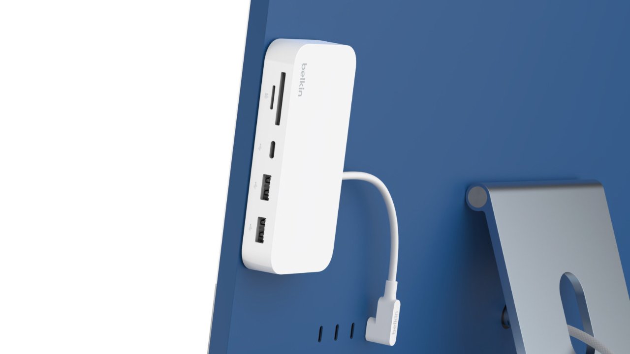 The Belkin 6-in-1 hub attaches to a Mac with an adhesive strip