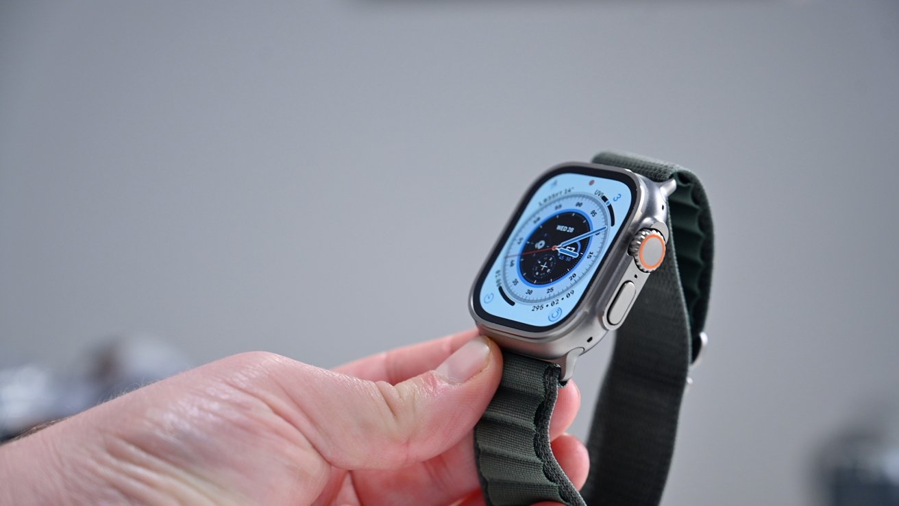 Holding Apple Watch Ultra