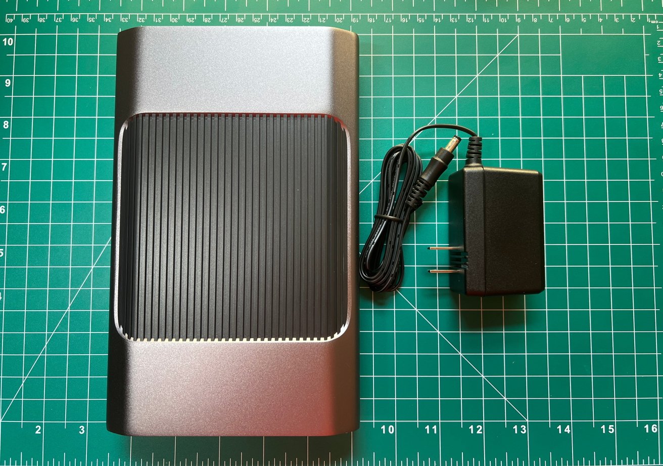 The SanDisk Professional G-Drive and its power adapter. 