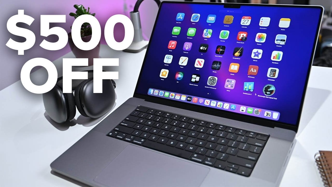 MacBook Pro 16-inch on desk with $500 off on text