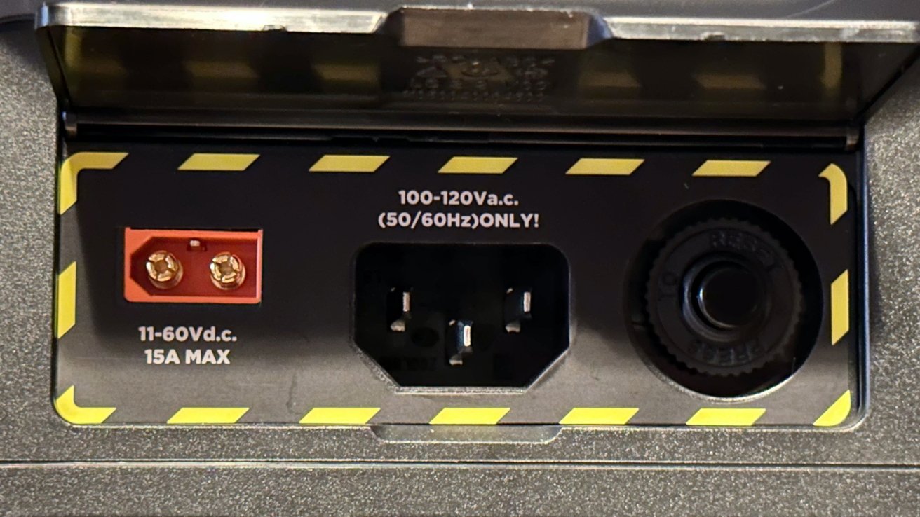 Solar/Car charge input, AC outlet input, and a safety reset button behind a rear door