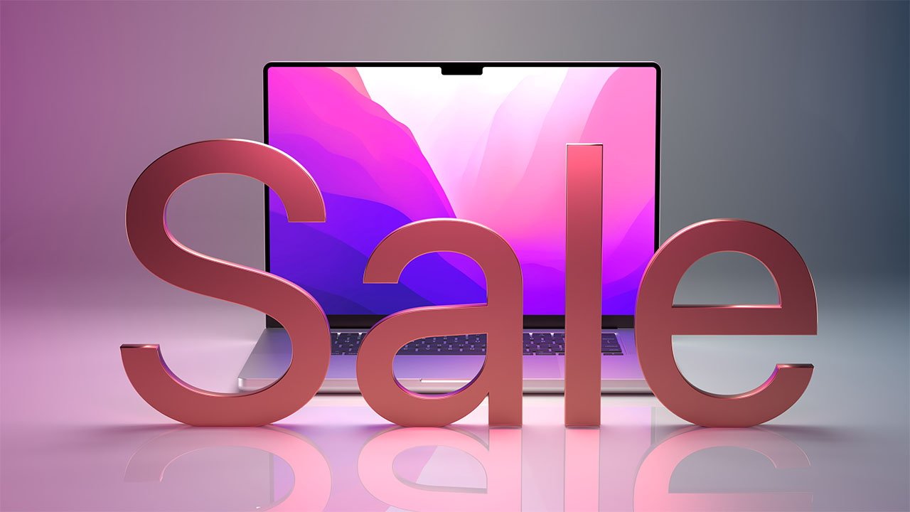 14-inch MacBook Pro with pink 3D sale text