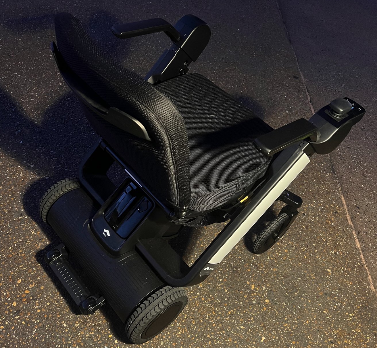 Whill Model F wheelchair, rear motor assembly and battery compartment, with right-mounted control stick
