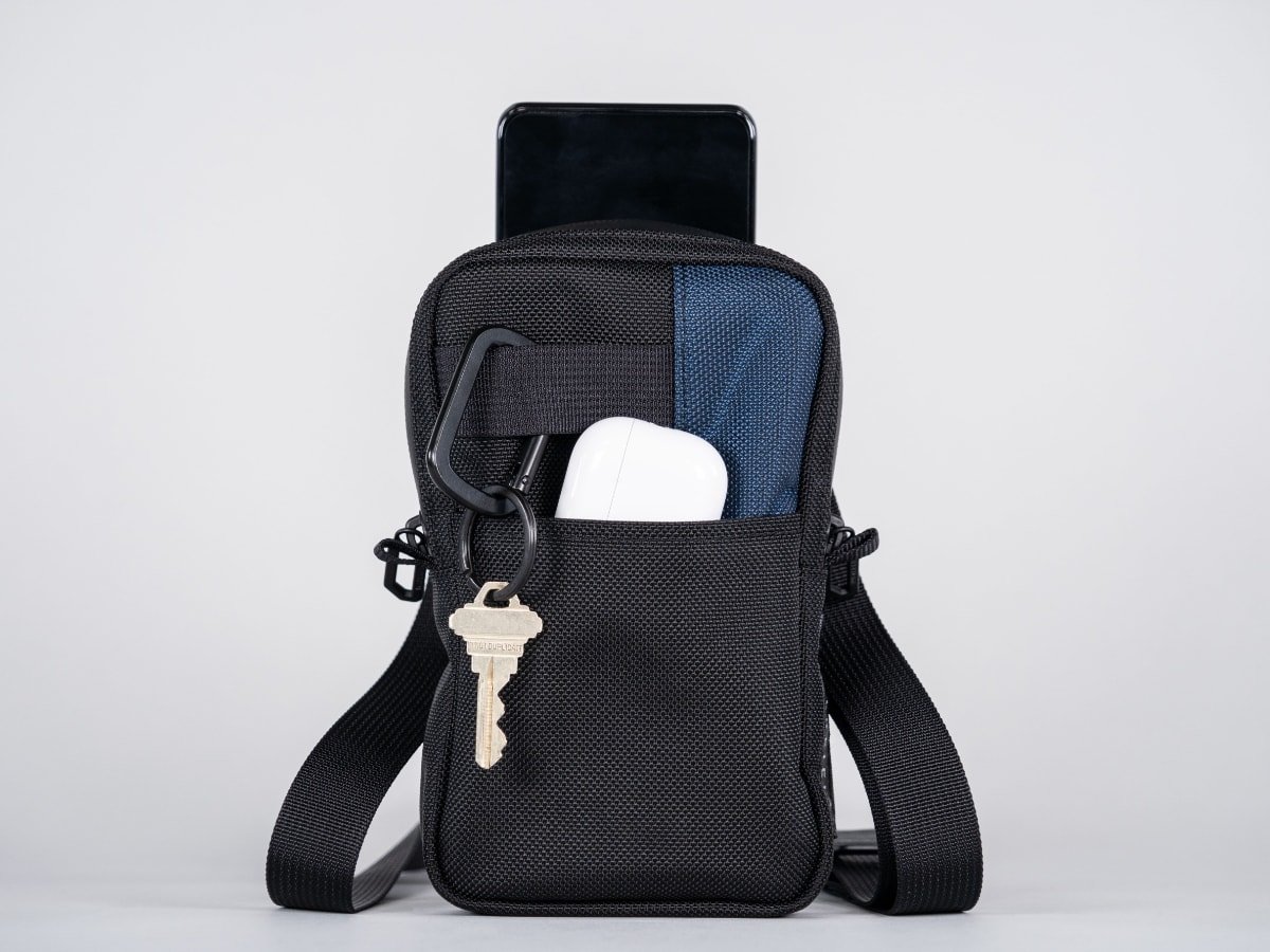 The bag can fit several small items with an iPhone