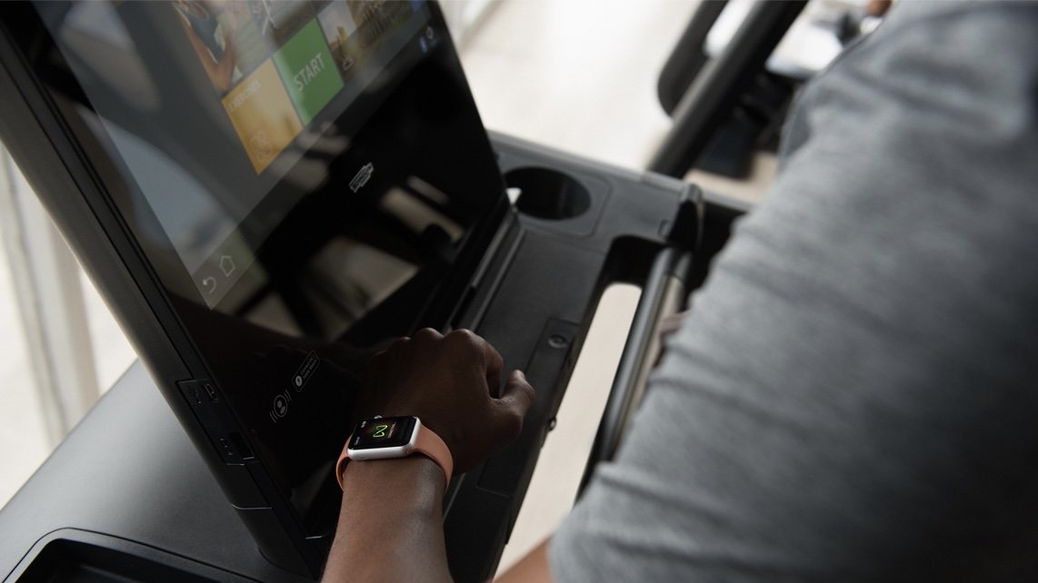 A user on a Peloton-style exercise bike