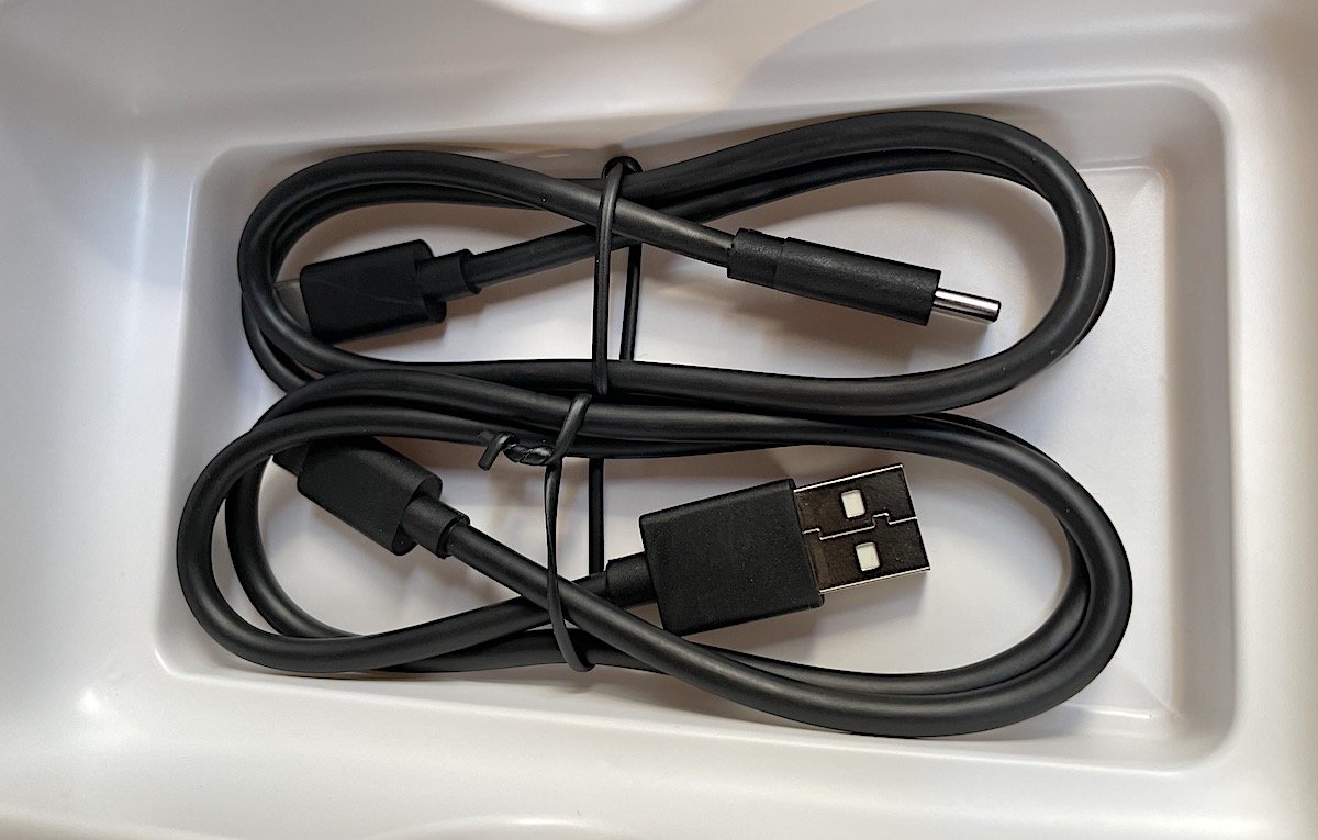 USB-C to C and USB-A to C included, but attached velcro bands rather than wire ties would have been nice.