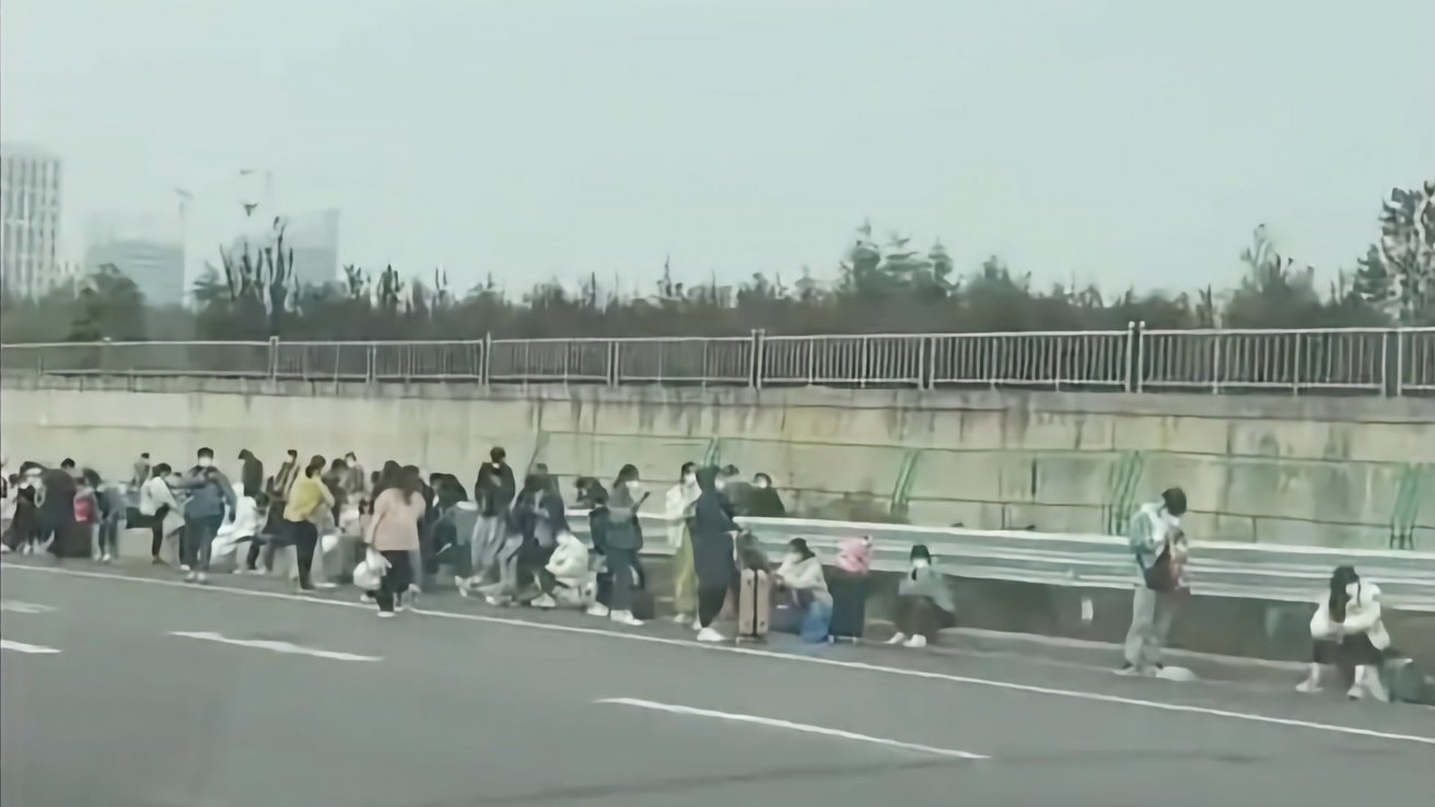 Foxconn workers leaving the factory [via Twitter/@alexludoboyd]