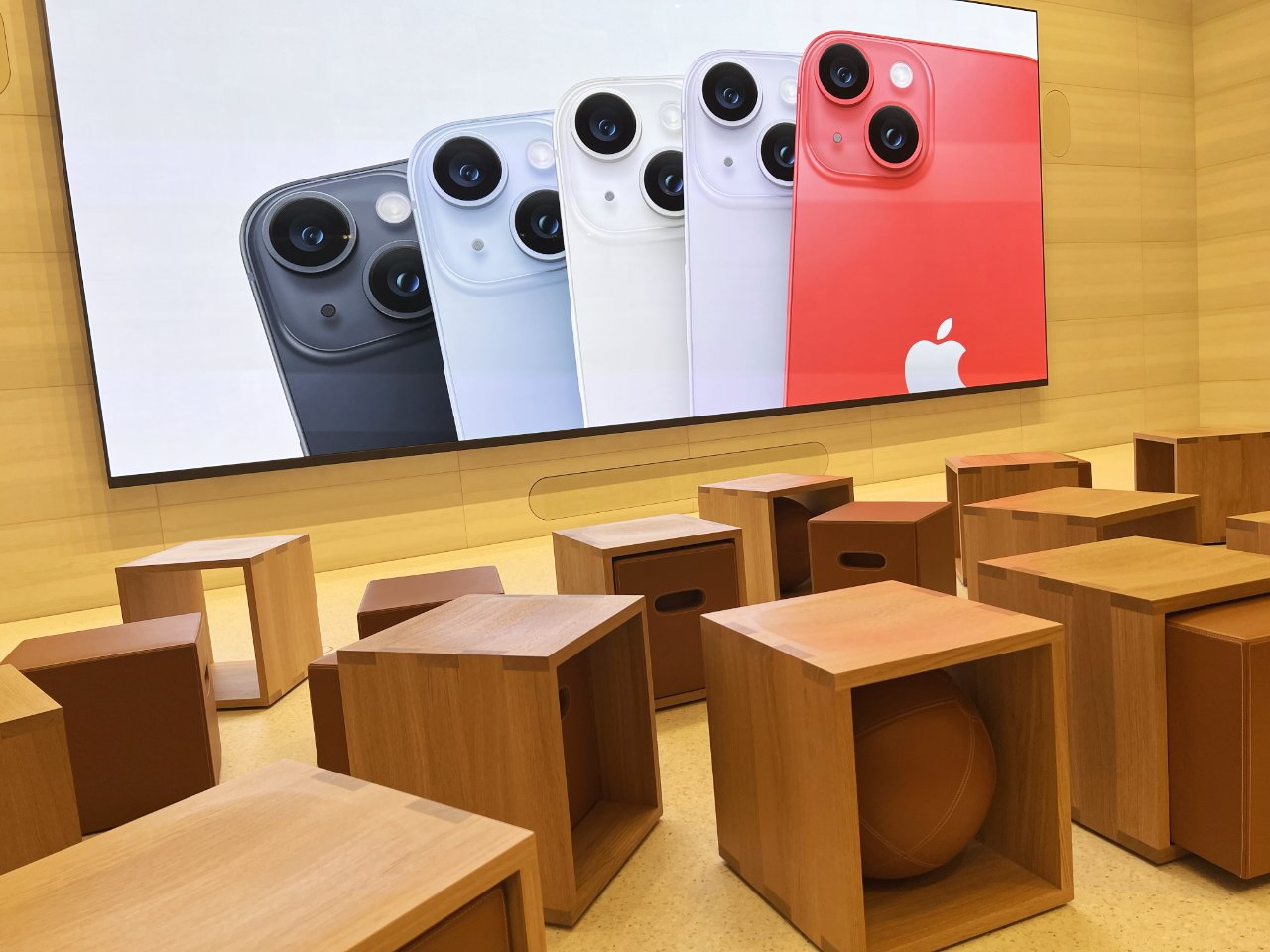 Forty wooden cubes with extra seats in most of them, in the Today at Apple section