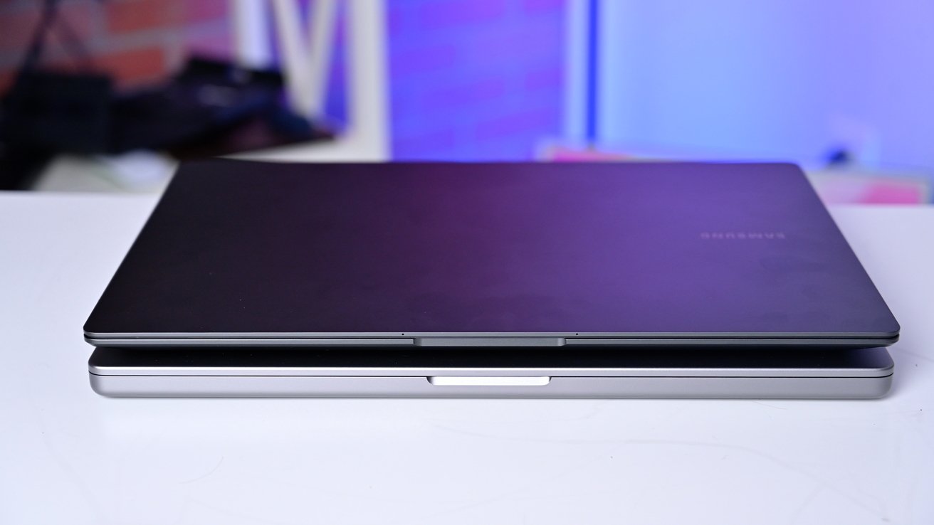 The Galaxy Book 3 Ultra on top of the 16-inch MacBook Pro