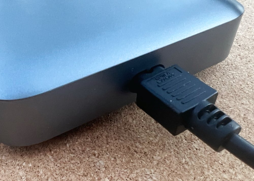 The power cord doesn't fit flush, but you don't need a separate power brick, either