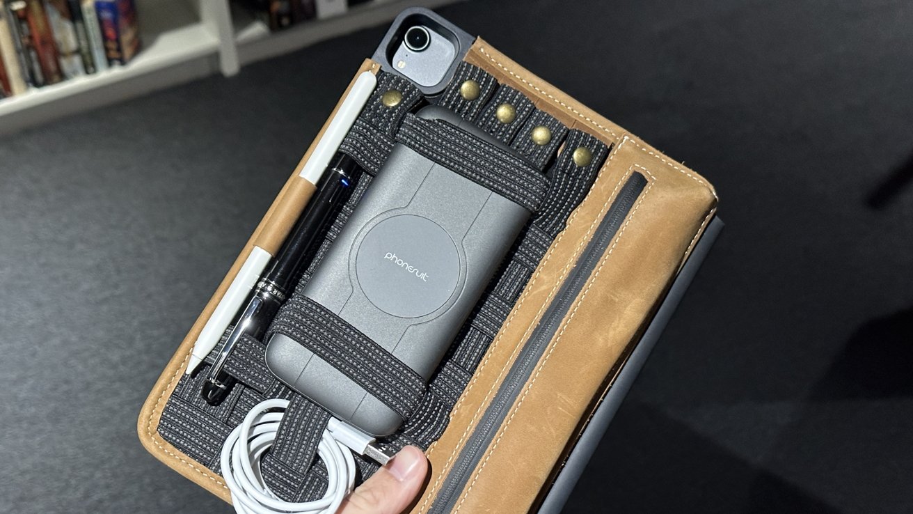 The oriGrid holding a USB-C cable, PhoneSuit charger, Adonit Star, and Apple Pencil.