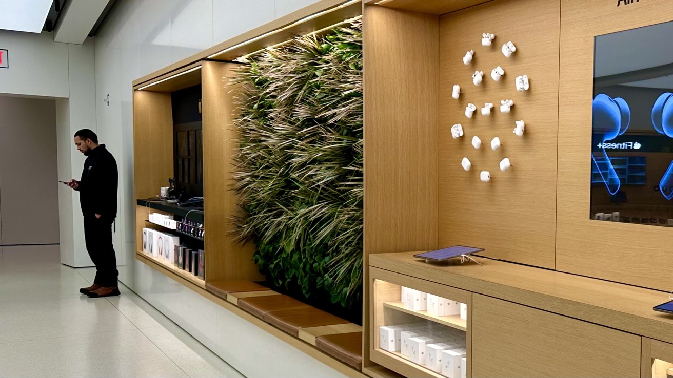 A seating area inside a wooden AirPods display