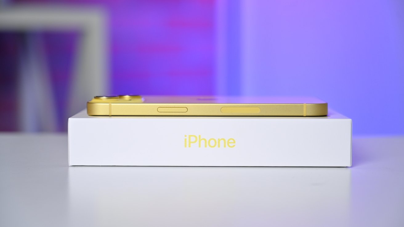 https://photos5.appleinsider.com/gallery/53446-107380-Yellow-iPhone-14-on-Box-From-Side-xl.jpg