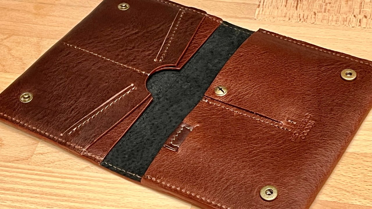 Geometric Goods AirTag travel wallet has a lot of space for cards and a passport