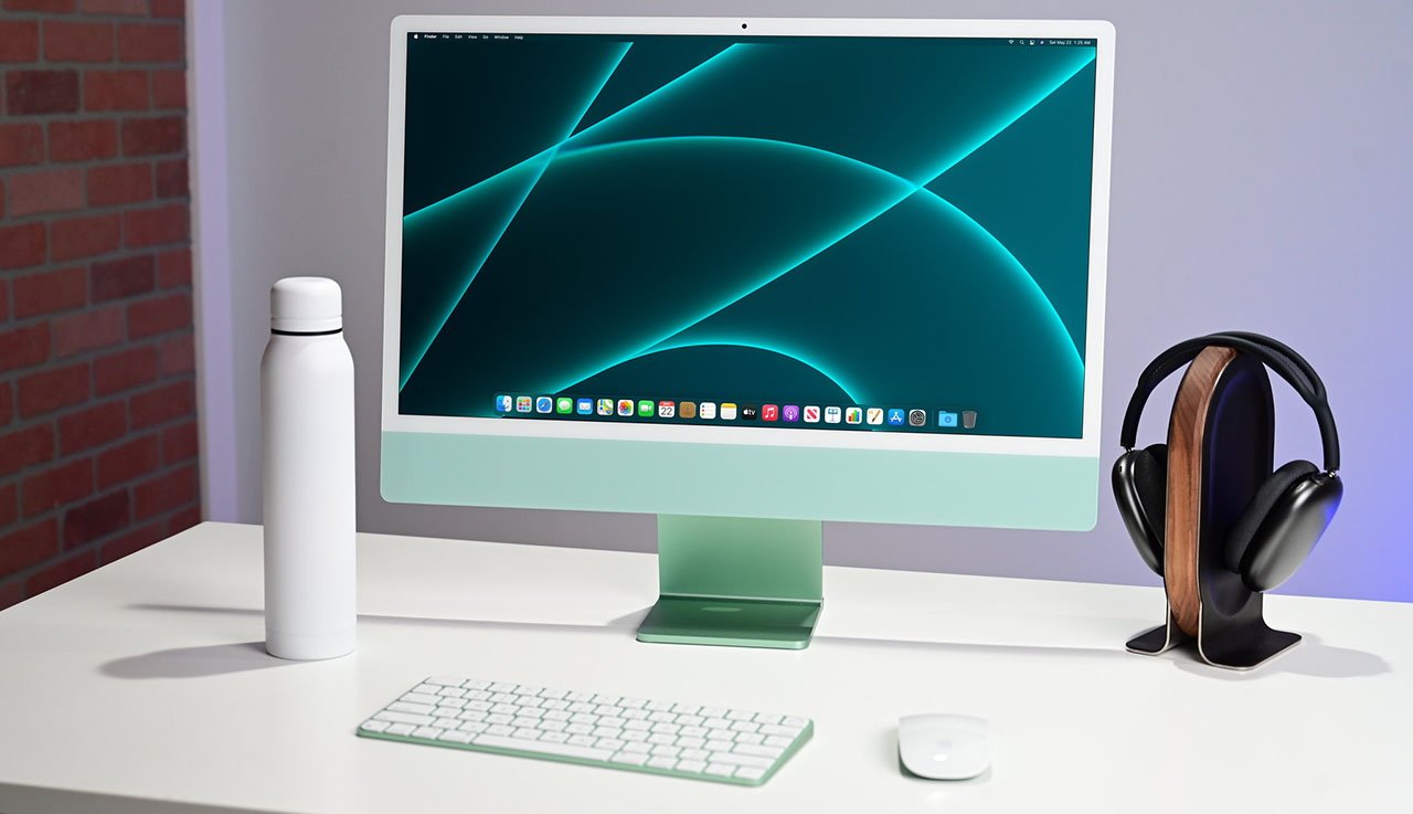 Apple's all-in-one desktop is heavily reduced with open-box deals | iMac 24-inch in Green on desk