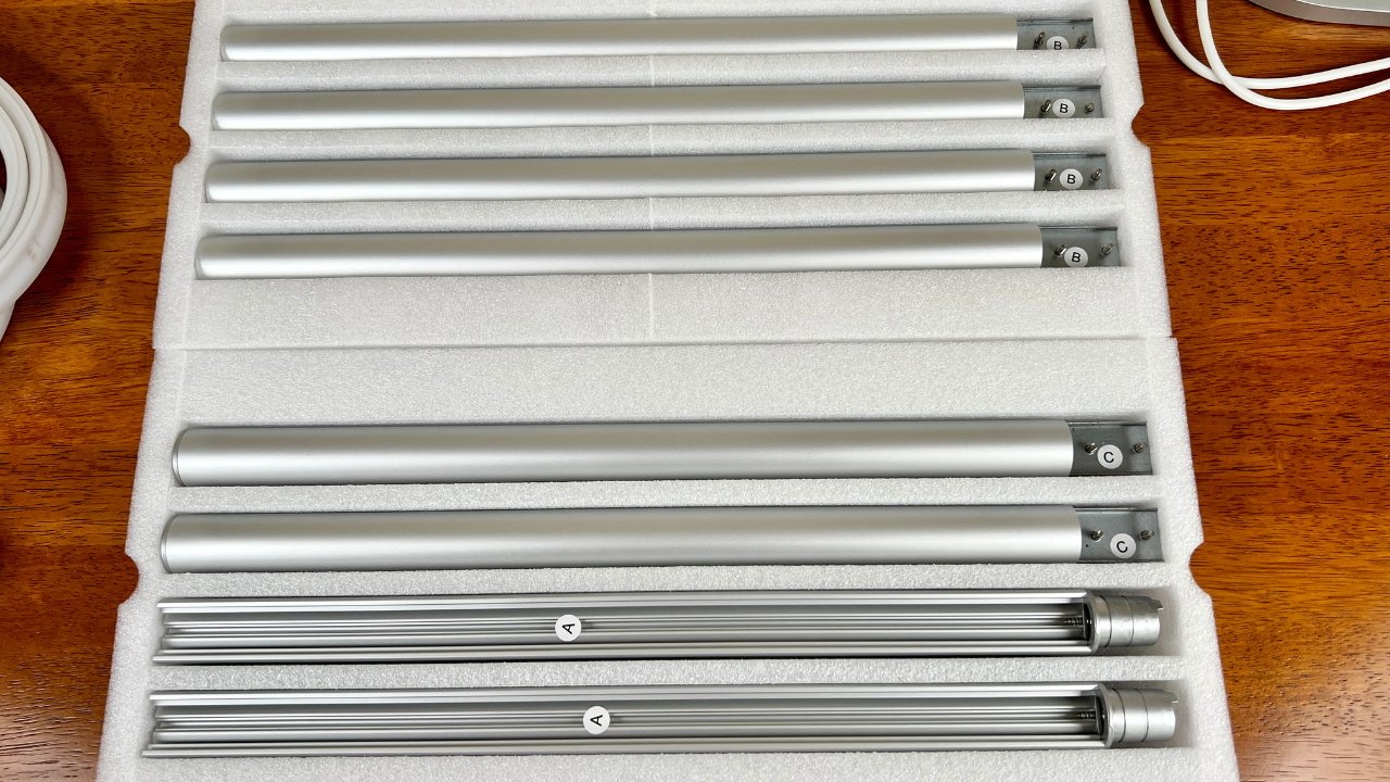 Setup of the Mujoy floor lamp include attaching these metal bars