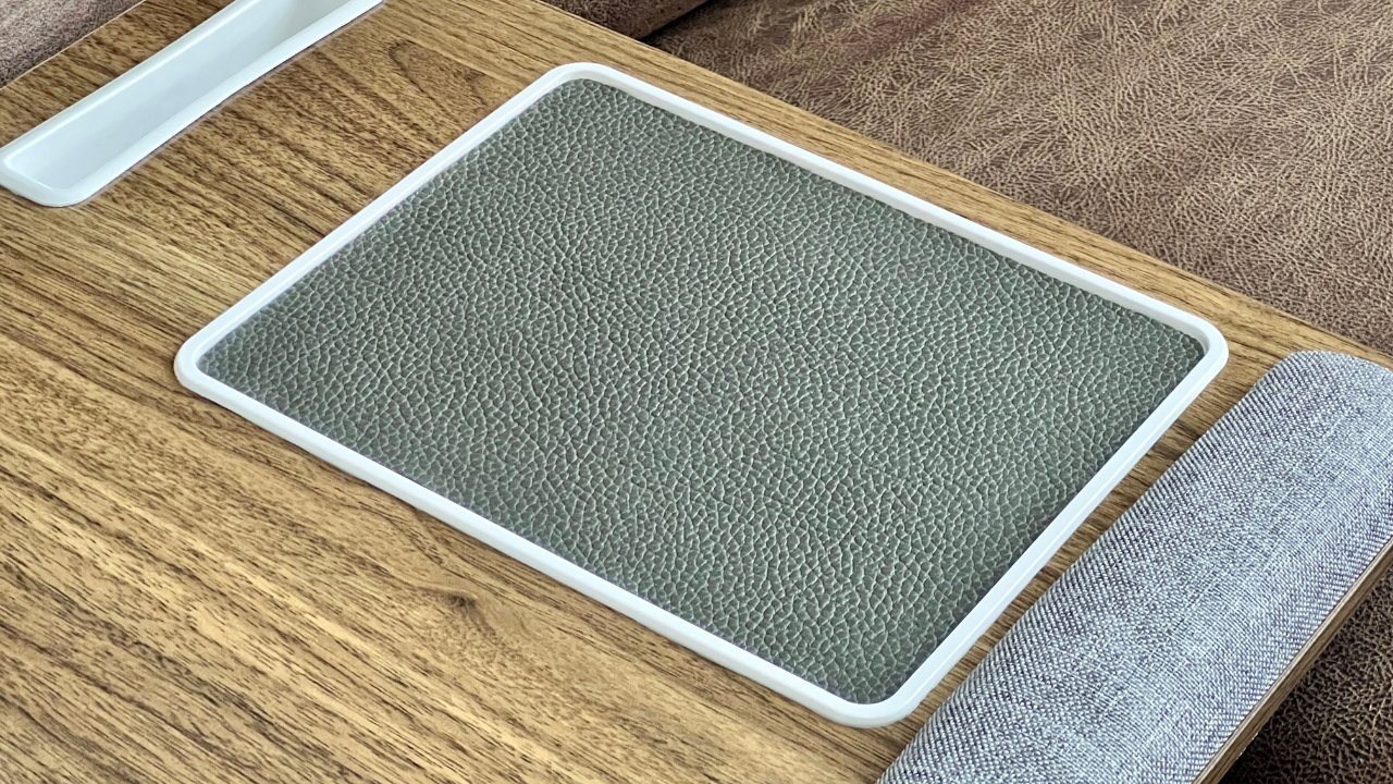 The Huanuo lap desk includes a non-removable mouse pad