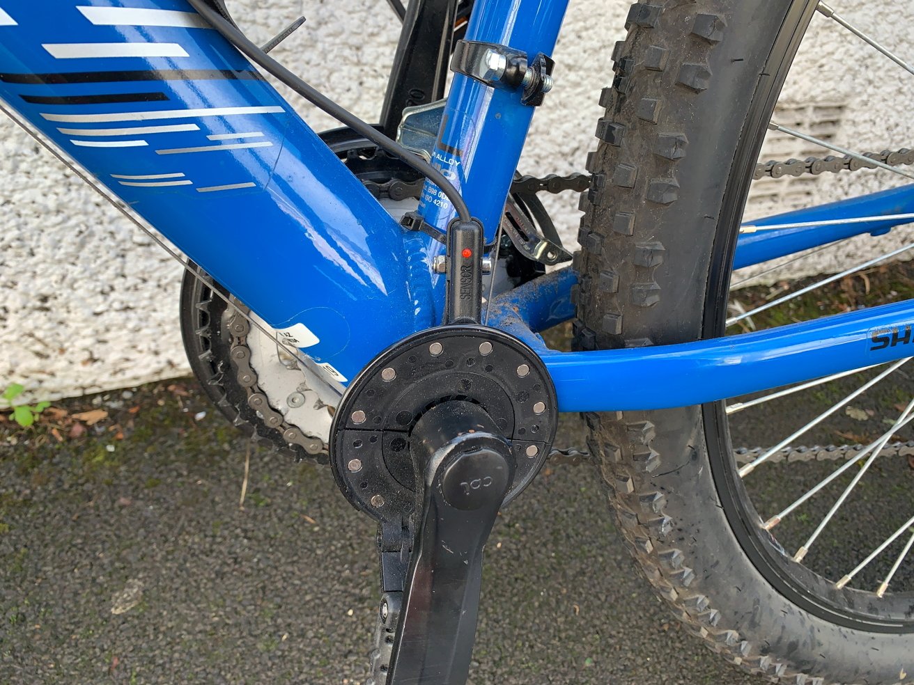 Magnetic disks are attached to the pedal, which activates the motor.