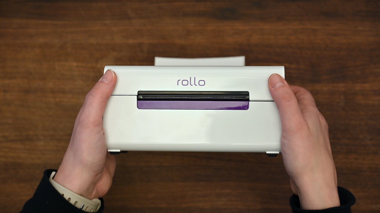 Holding the Rollo printer in our hands