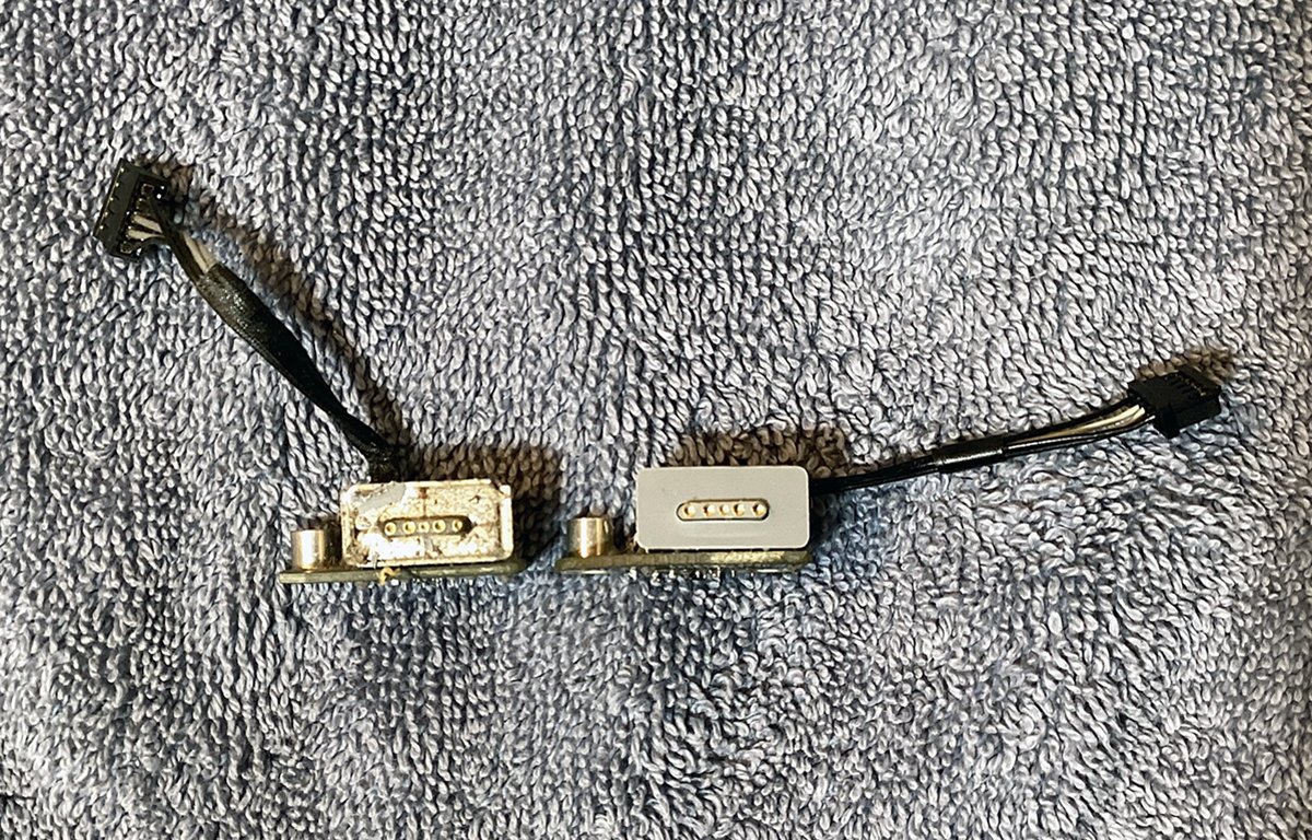 Old MagSafe charge port, left, and new refurbished one ready to install, right.