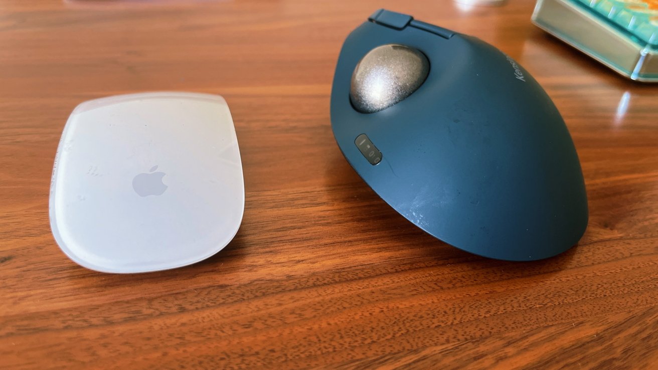 The TB550 next to the Apple Magic Mouse included with the 2021 iMac