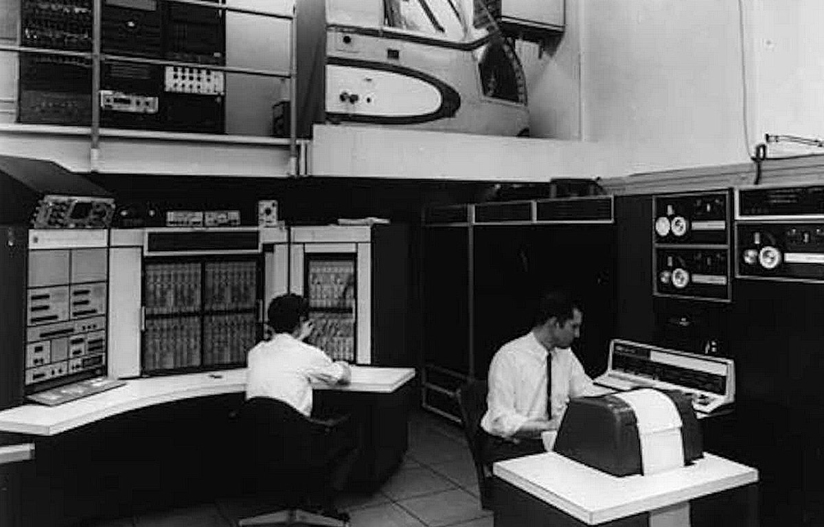 Early mainframe running on the ARPANET - the precursor to the internet. Note the paper dumb terminal on the right.