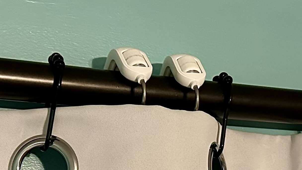 SwitchBot Curtain 3 review: Hooks visible behind a curtain