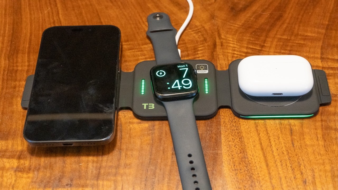 An iPhone, Apple Watch, and AirPods Pro on the T3 charging station.