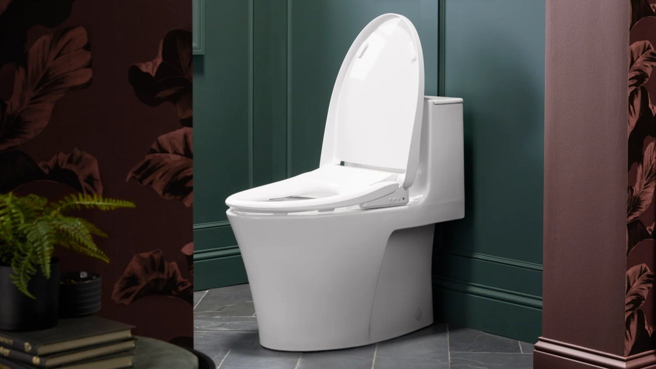A modern white toilet with the seat lid up, set against a dark green and maroon wall with tropical leaf patterns.