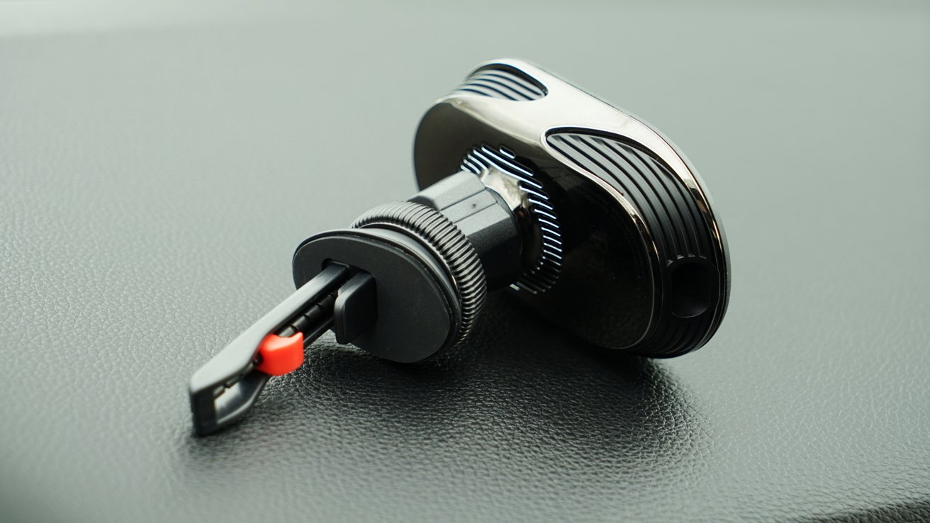The back of Pitaka's car charger with the vent clip attached. The grooved adjustment knob is visible behind the charger's shiny surface.