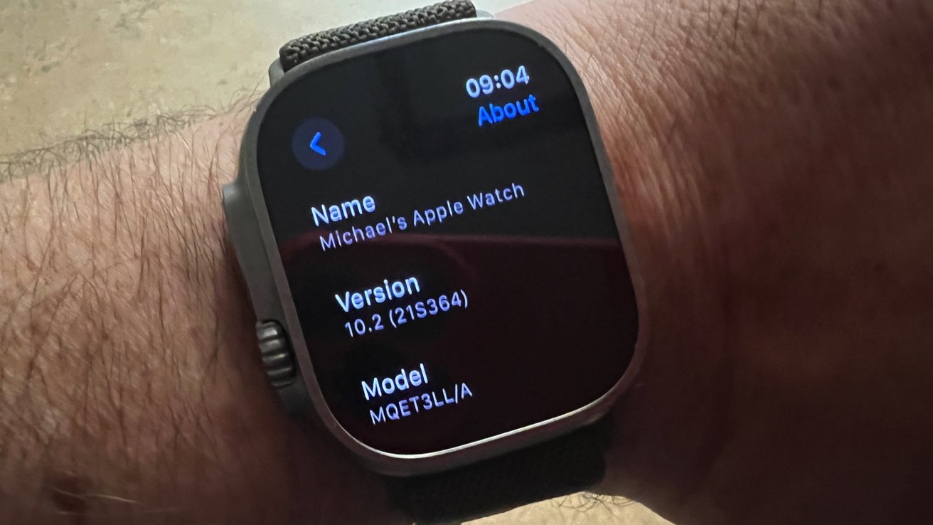Apple Watch Ultra on a man's wrist, showing the model number
