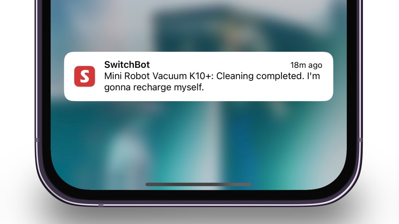 Smartphone notification from SwitchBot on a blurred background, stating