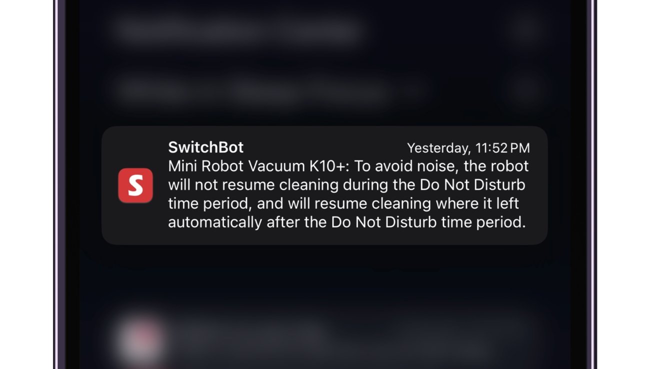 A smartphone screen displaying a notification from SwitchBot about a Mini Robot Vacuum K10+ that won't resume cleaning during Do Not Disturb mode but will continue afterward.