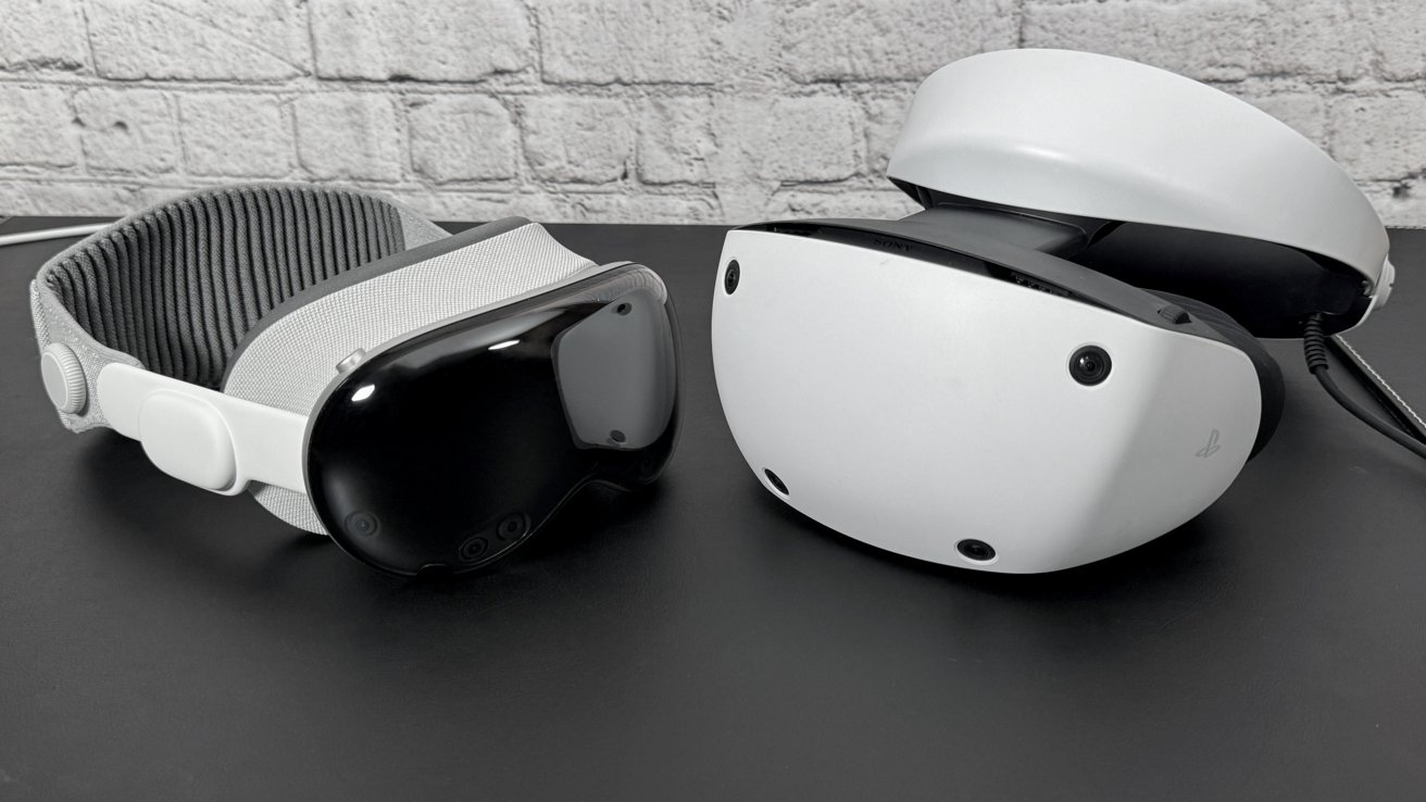Apple Vision Pro on the left and PlayStation VR 2 on the right sitting on a table with a white brick background.