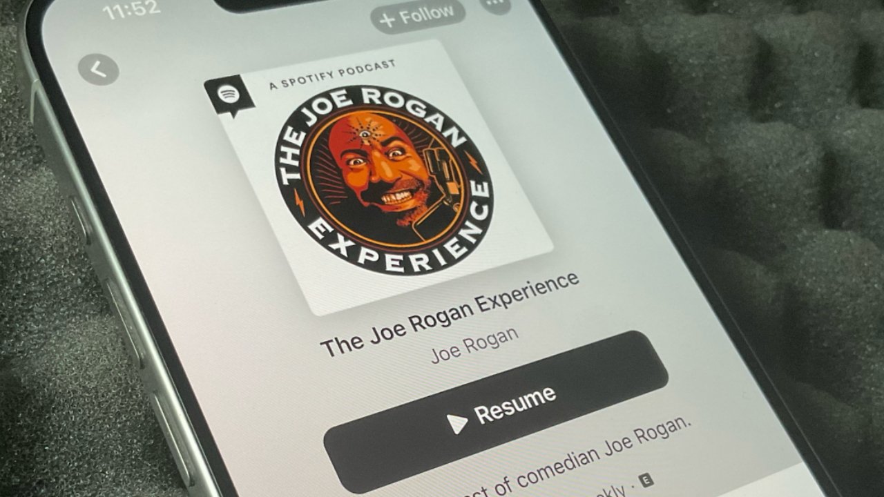 Smartphone screen displaying The Joe Rogan Experience podcast on Apple Podcasts