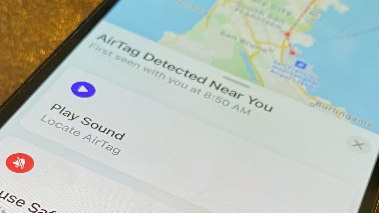 Smartphone displaying notification for 'AirTag Detected Near You' with map background and 'Play Sound' button visible.